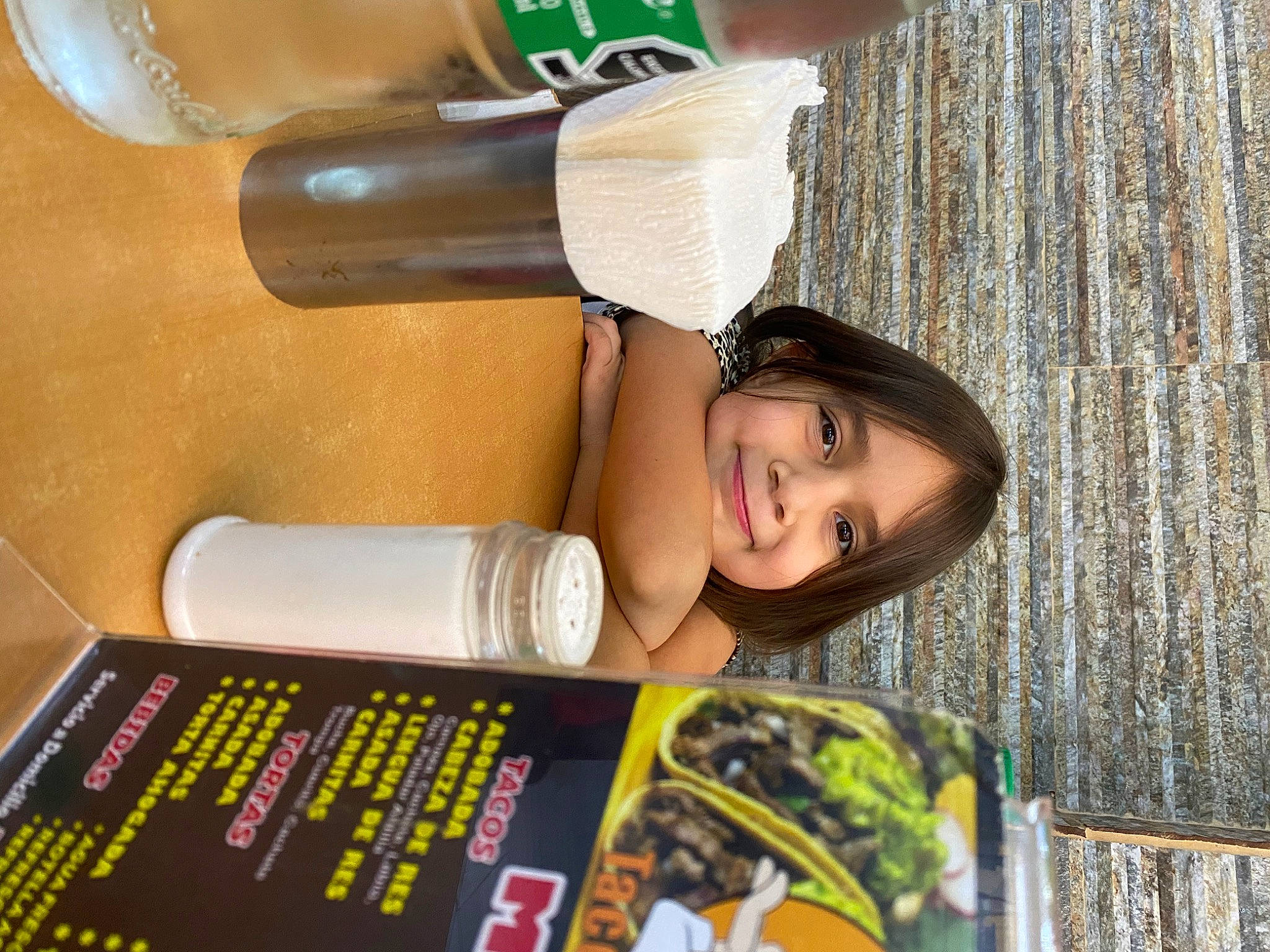 Lizette is registered to the contest to win money with this photo: audio_equipment, child, drink, drinkware, eyelash, fun, happy, human_leg, joy, leisure, nail, person, plastic, plastic_bottle, recreation, room, smile, sports_equipment, tree, water