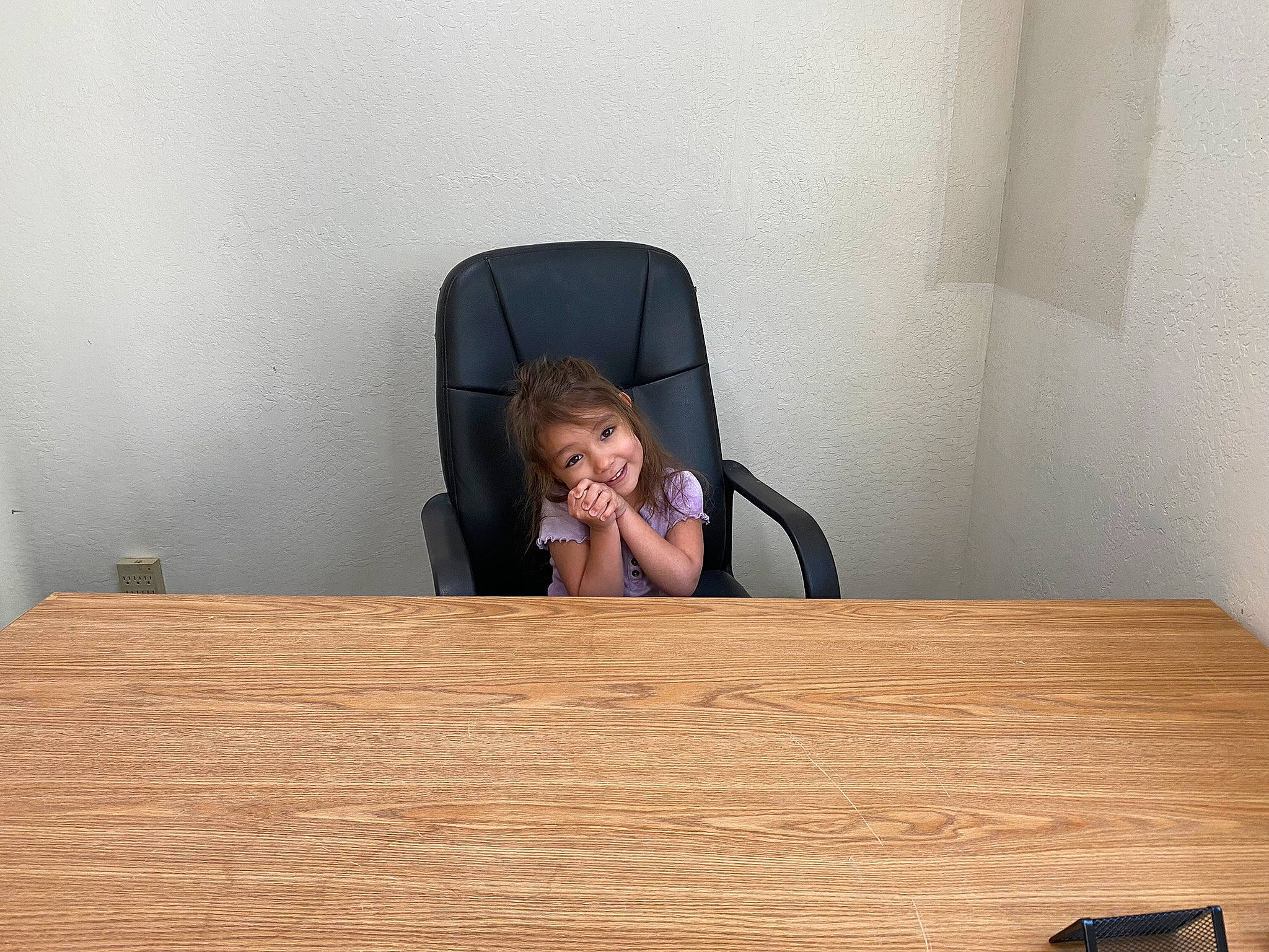 Arielle joined the competition — help win amazing prizes! chair, comfort, desk, event, eyewear, flooring, furniture, hardwood, joy, laminate_flooring, person, plank, plywood, rectangle, room, sitting, table, toddler, varnish, wood