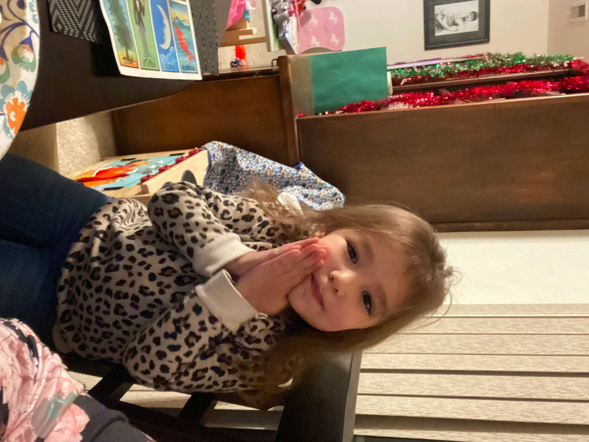 Arielle is registered to the contest to win money with this photo: art, child, comfort, couch, event, flooring, fun, hairstyle, happy, holiday, human, mammal, pattern, people, person, picture_frame, room, sitting, smile, toddler