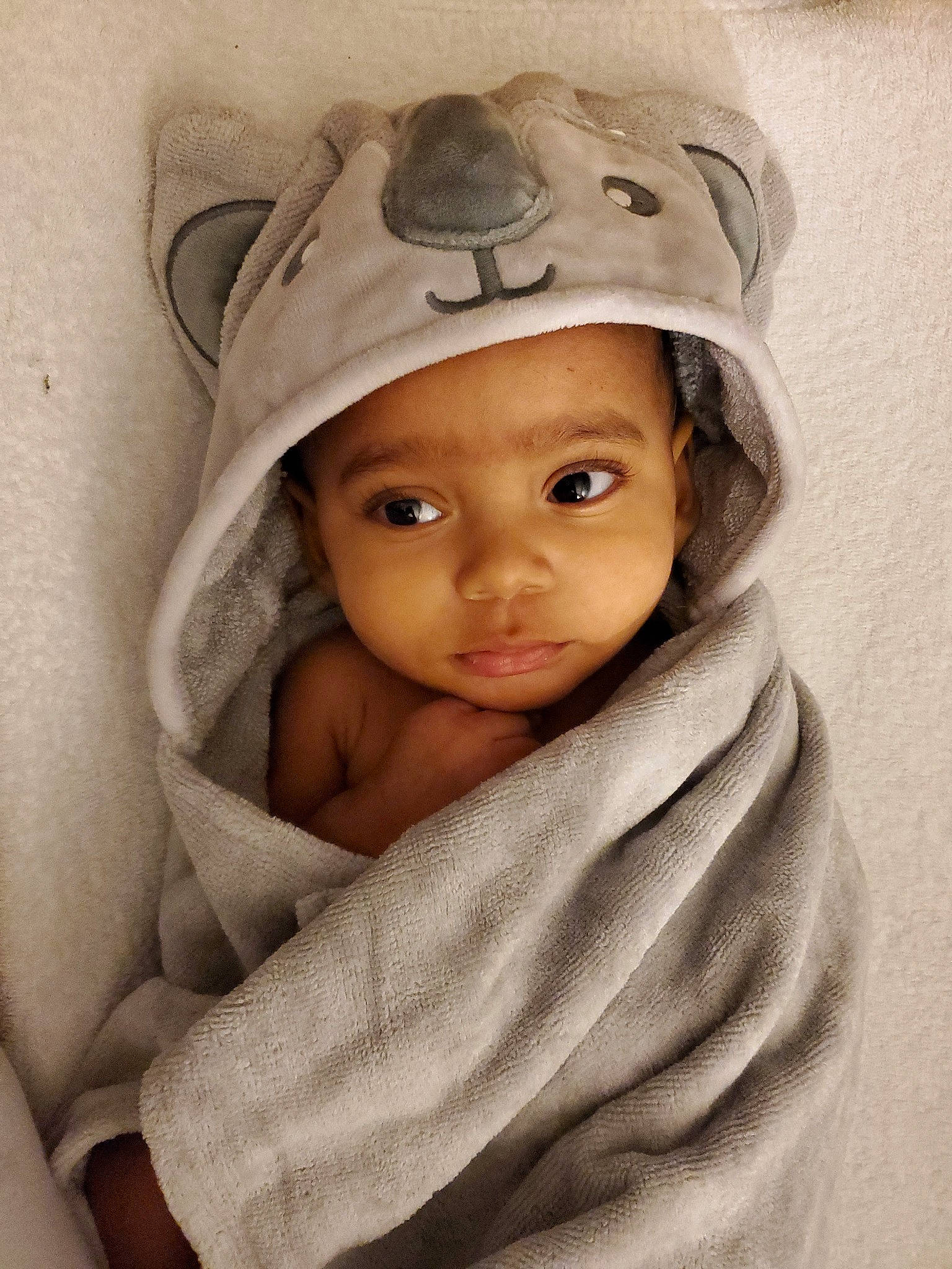 Kalel is registered to the contest to win money with this photo: baby, cheek, child, eye, head, headgear, headwear, linens, person, skin, toddler