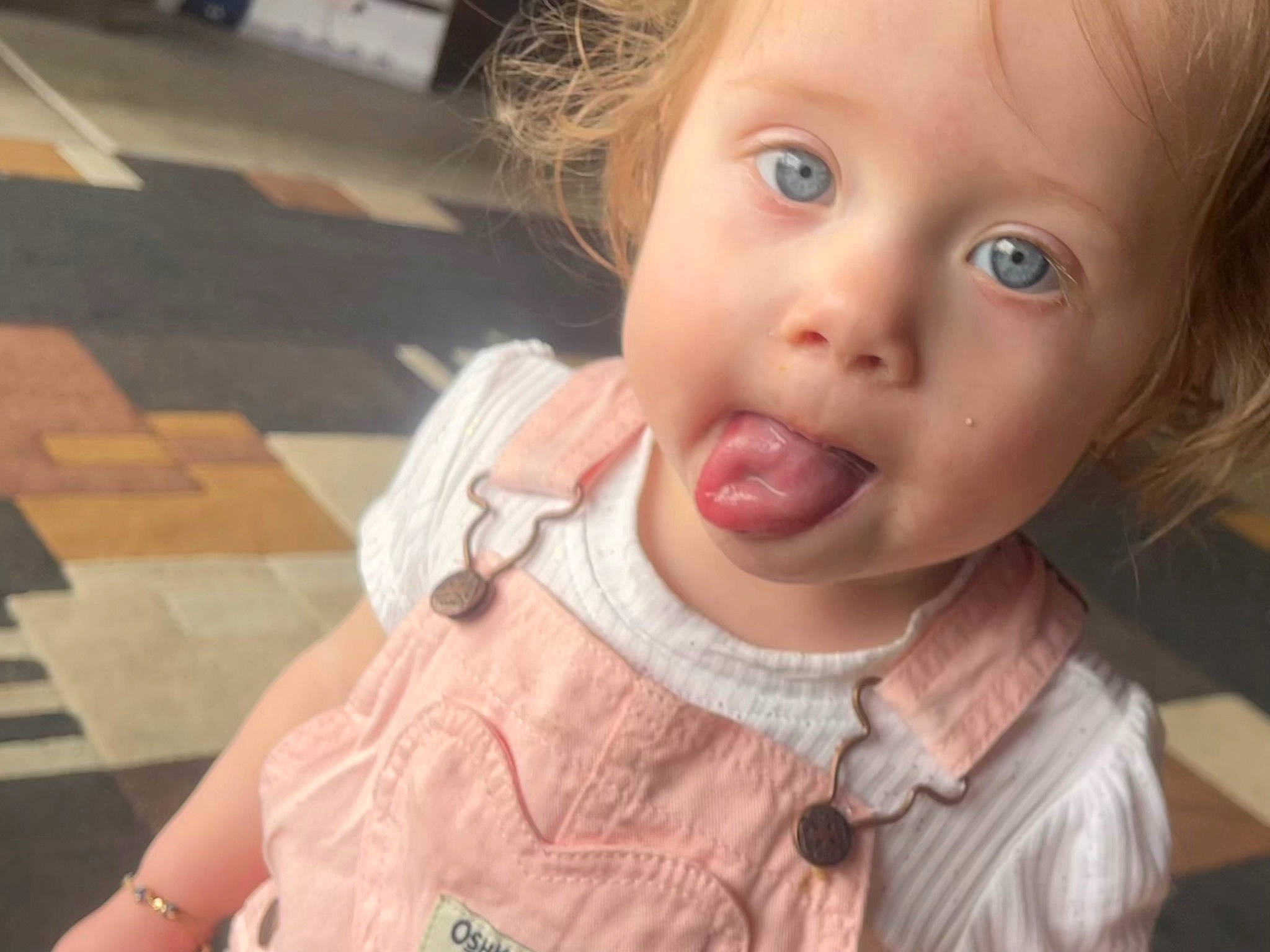 Leilani is registered to the contest to win money with this photo: cheek, chin, ear, eye, eyebrow, eyelash, face, gesture, hair, happy, head, iris, jaw, lip, mouth, nose, person, skin, sleeve, toddler