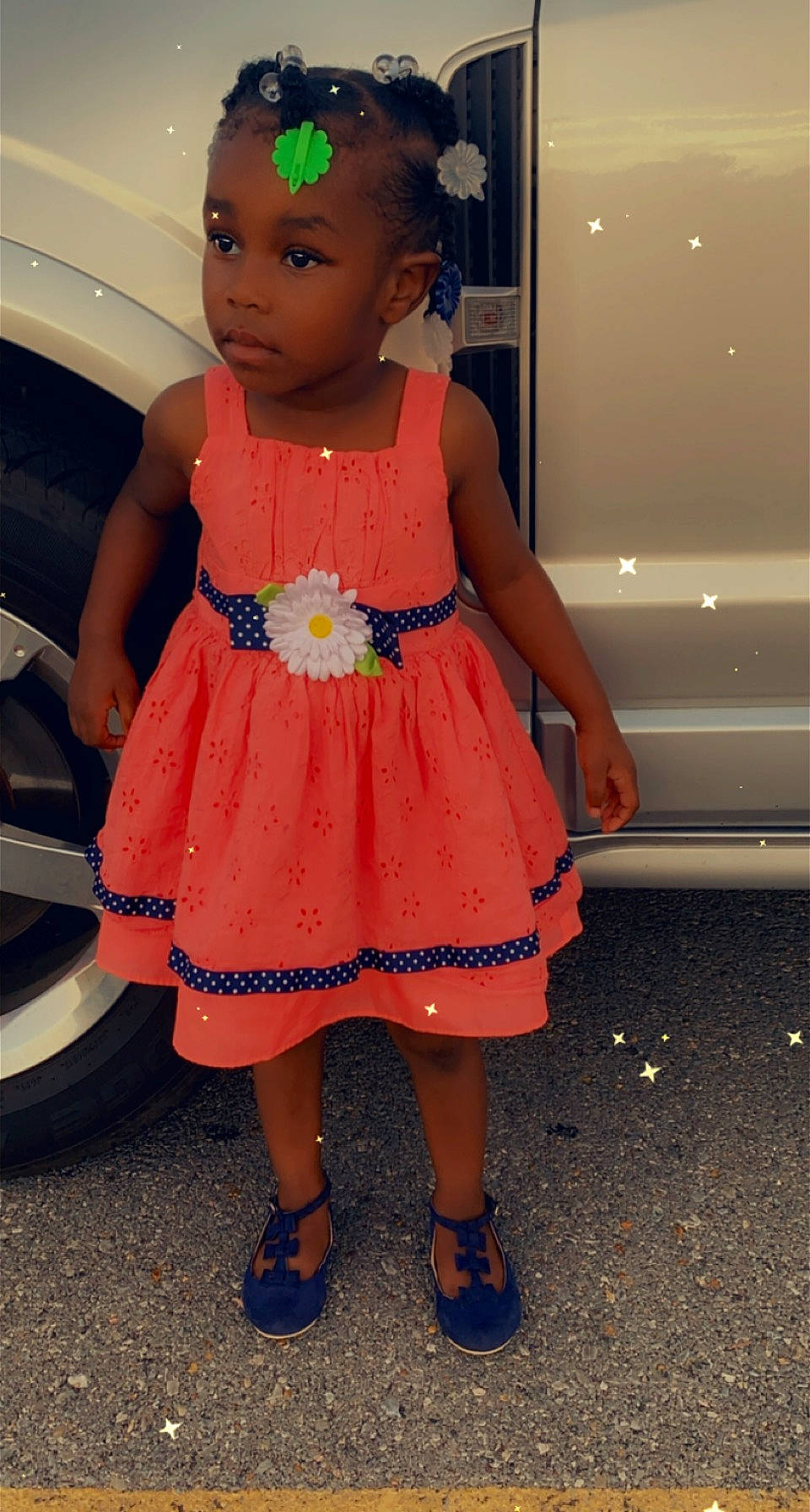 Teighan is registered to the contest to win money with this photo: automotive_lighting, baby_toddler_clothing, child, cocktail_dress, day_dress, dress, electric_blue, fun, happy, human_leg, leg, magenta, one_piece_garment, pattern, person, pink, sandal, thigh, toddler, vehicle_door