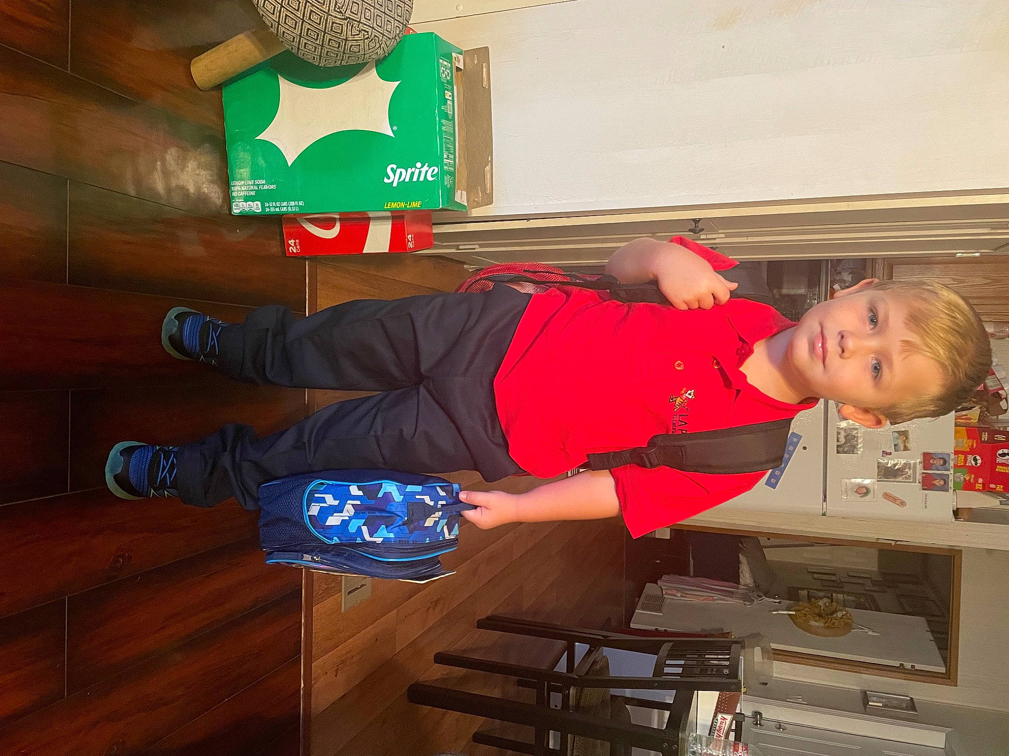 Robert is registered to the contest to win money with this photo: child, electric_blue, event, fun, hat, human_leg, knee, machine, person, room, shorts, sportswear, t_shirt, thigh, toddler, walking_shoe