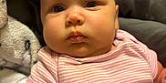 Jaelynn joined the competition — help win amazing prizes! arm, baby, blanket, child, clothing, cushion, cute, expression, face, fist, indoor, infant, newborn, onesie, person, pink, portrait, skin, soft, striped