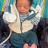 newborn, baby, infant, car_seat, clothing, mittens, feet, sleeping, pattern, fabric, child, cute, peaceful, bundle, jacket, zipper, toy, pacifier_clip, indoor, portrait