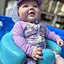 baby, blue_seat, child, closeup, cute, daylight, floral_pattern, happy, hat, infant, outdoor, pool, seat, sitting, smiling, summer, sun_hat, swimsuit, water, water_droplets
