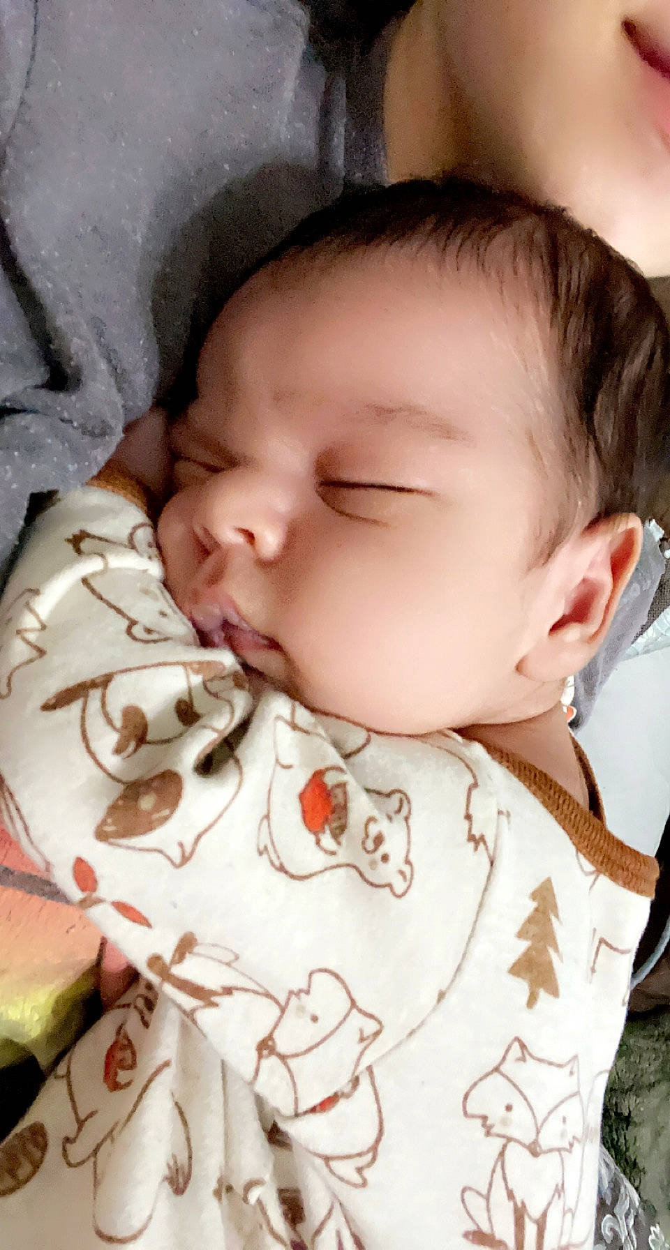 Sebastian is registered to the contest to win money with this photo: baby, cheek, chin, comfort, eyebrow, eyelash, face, facial_expression, forehead, human, lip, mouth, neck, nose, organ, person, product, skin, textile, vertebrate