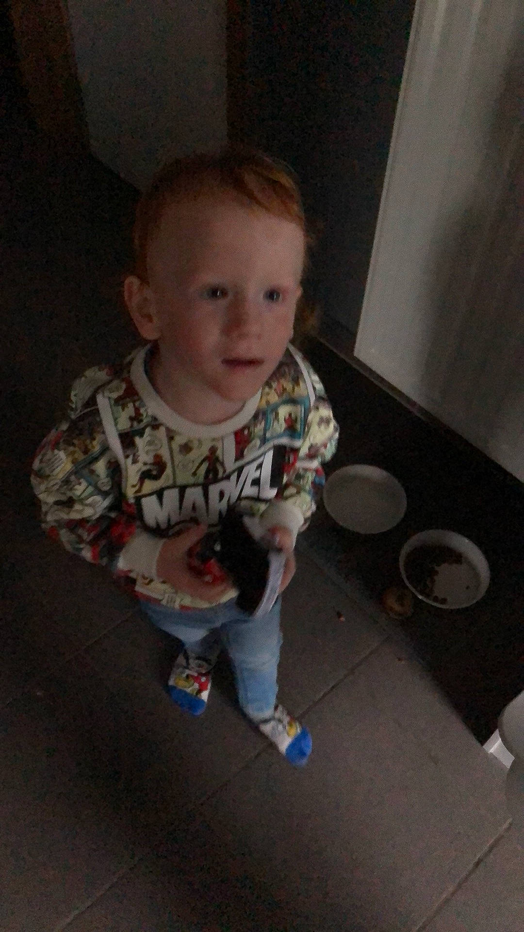 Eden participe au concours pour gagner de l'argent avec cette photo : baby, baby_toddler_clothing, cheek, chin, eye, floor, flooring, fun, hardwood, iris, mouth, nose, person, sitting, skin, sleeve, smile, standing, t_shirt, toddler