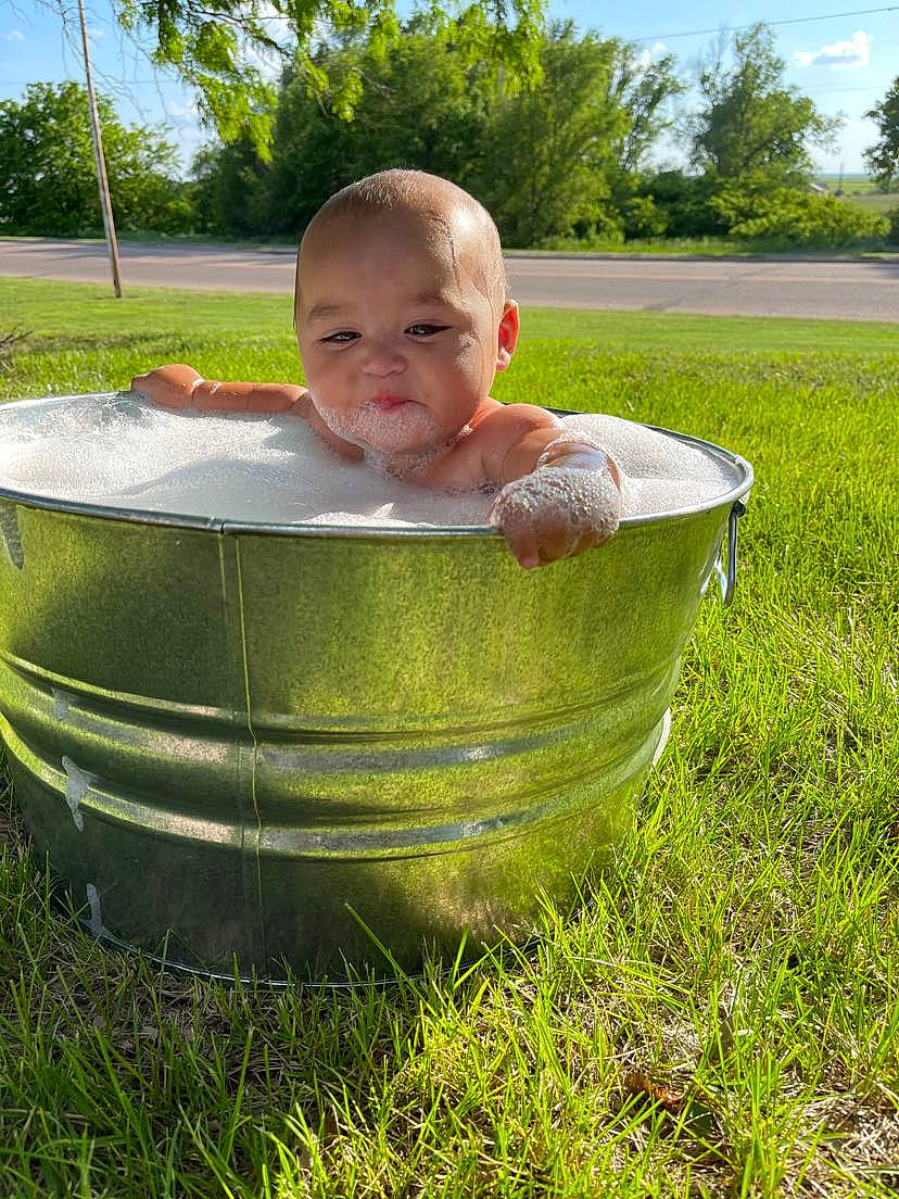 Massiah joined the competition — help win amazing prizes! baby, baby_toddler_clothing, child, fun, garden, grass, grass_family, grassland, groundcover, happy, leisure, people_in_nature, person, plant, shrub, sitting, sky, smile, toddler, tree