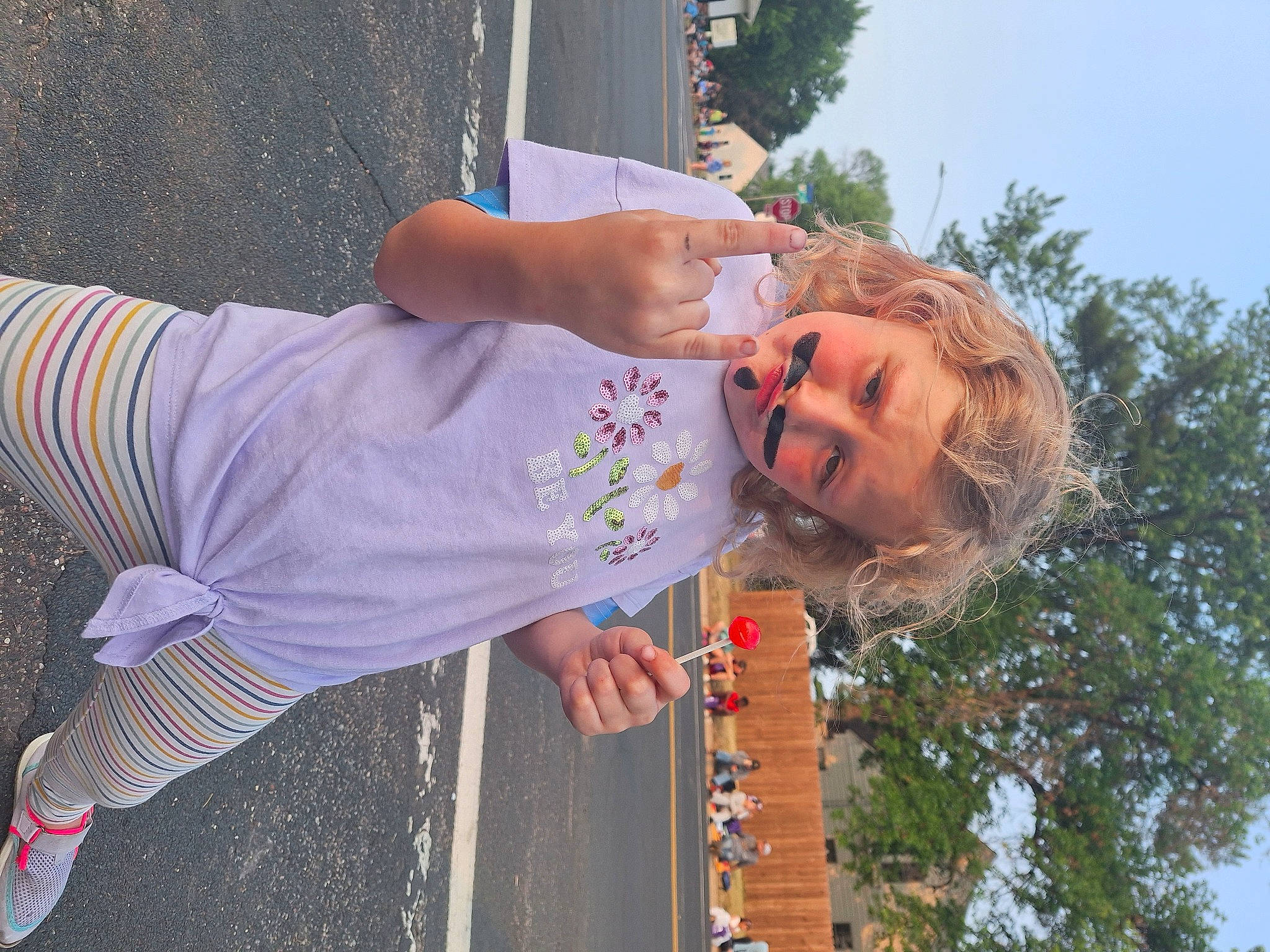 Athena is registered to the contest to win money with this photo: child, fun, grass, happy, leisure, musical_instrument, person, plant, recreation, sky, summer, t_shirt, toddler, tree, vacation