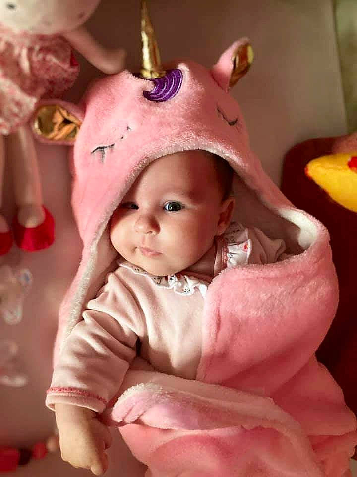 Noëlya a rejoint le concours — aidez-le/la à gagner de superbes lots ! baby, baby_toddler_clothing, cap, cheek, child, chin, costume_hat, dress, event, fashion_accessory, fun, hair_accessory, happy, headgear, headwear, magenta, party_supply, peach, person, pink