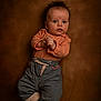baby, infant, child, portrait, clothing, pants, shoes, cute, expression, face, hair, background, laying, looking, curious, small_hands, footwear, soft_lighting, studio, casual