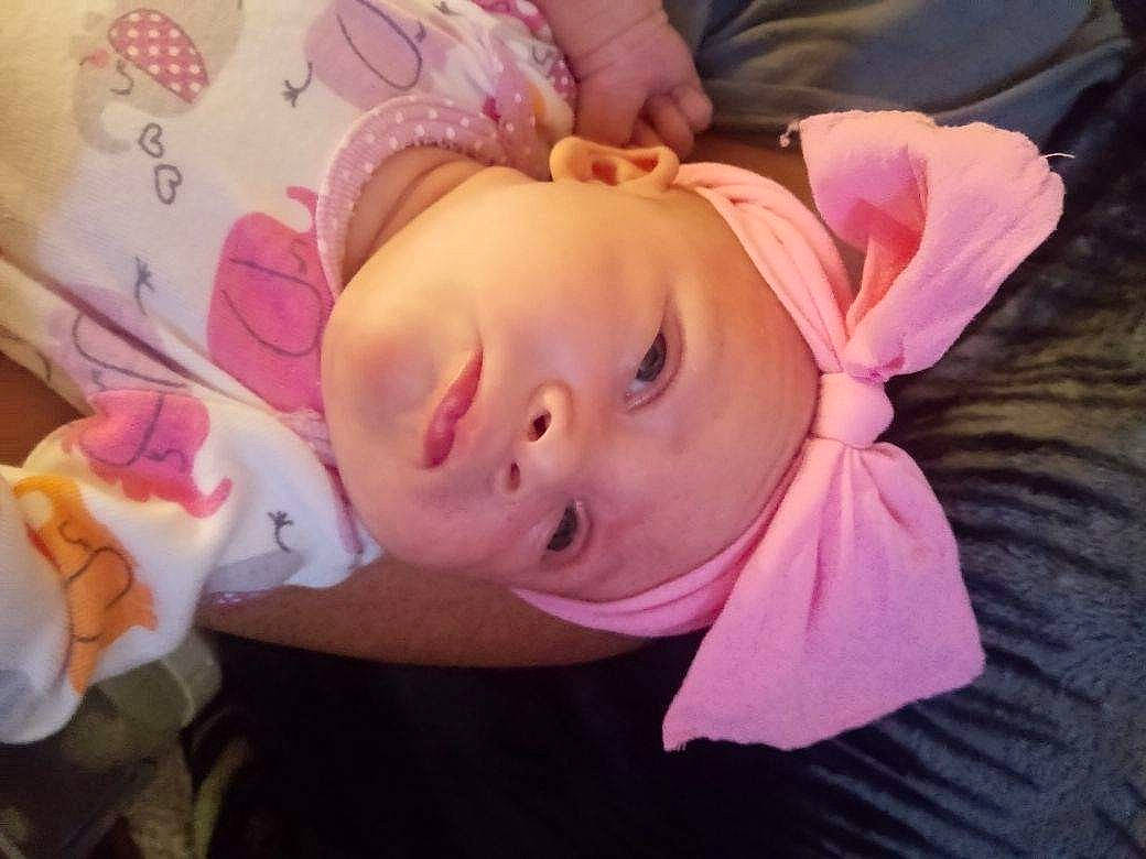 Angel is registered to the contest to win money with this photo: baby, baby_products, baby_toddler_clothing, cheek, child, ear, eyelash, grass, hair_accessory, happy, hat, headband, headgear, headwear, iris, lip, mouth, nose, person, pink