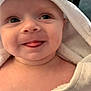 Vinnie is registered to the contest to win money with this photo: baby, towel, hood, face, tongue, skin, expression, cute, child, infant, playful, soft, white, closeup, portrait, smiling, indoors, person, newborn, happy