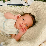Oliver is registered to the contest to win money with this photo: baby, infant, basket, knitted_blanket, blanket, outdoor, natural_light, face, eyes, hand, sleepwear, cute, newborn, portrait, soft_texture, woven, resting, baby_clothes, peaceful, infant_baby