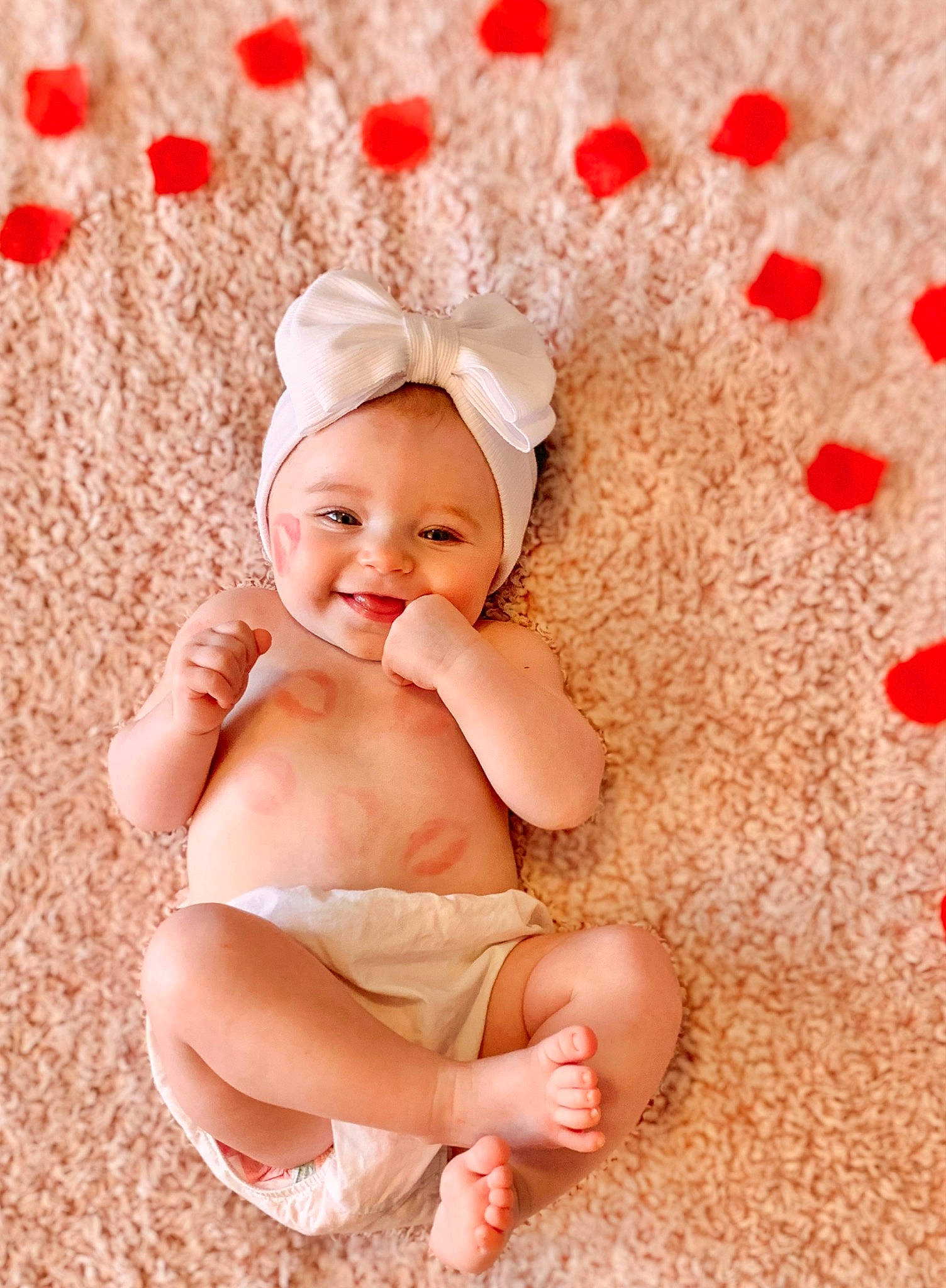 Baylor joined the competition — help win amazing prizes! baby, baby_toddler_clothing, carmine, child, finger, flooring, foot, fun, grass, happy, human_leg, joy, linens, pattern, peach, person, petal, pink, sitting, skin