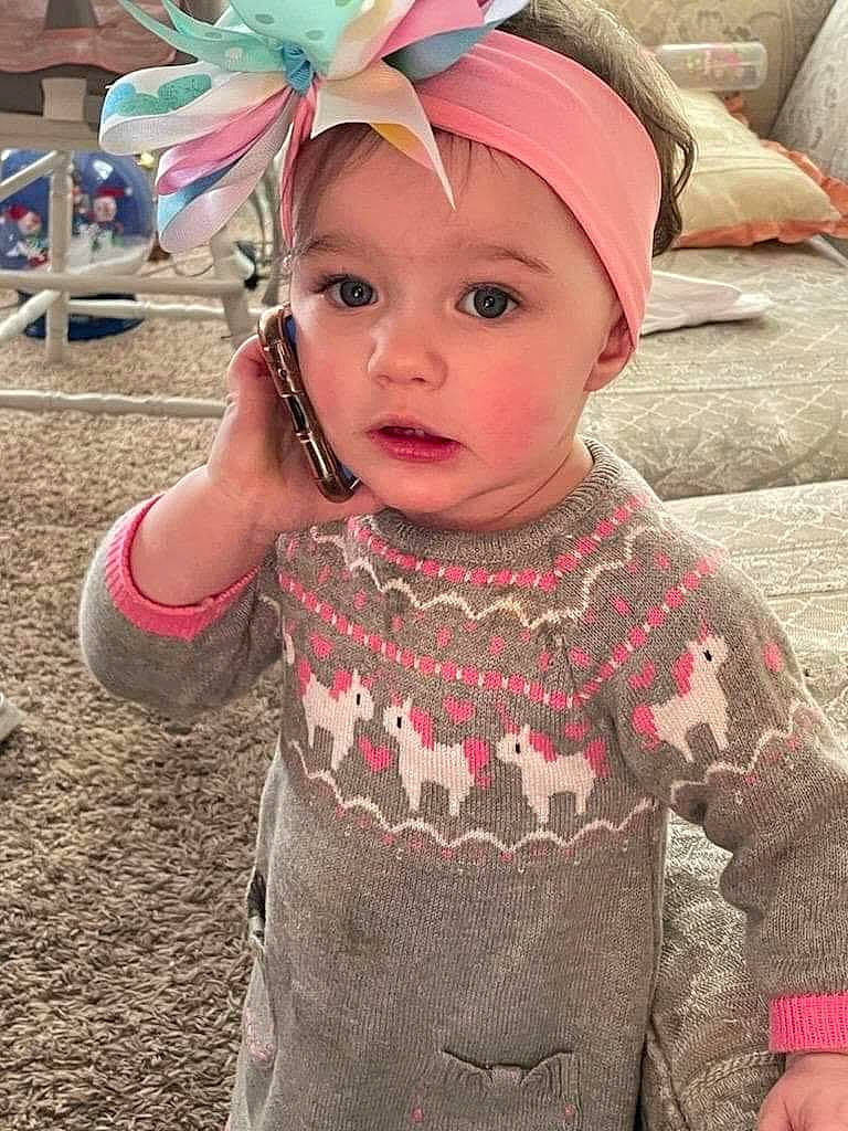 Aaliyah is registered to the contest to win money with this photo: baby, baby_toddler_clothing, cap, child, eye, fun, grass, happy, headband, headgear, headpiece, headwear, jewellery, magenta, pattern, person, pink, plant, skin, sleeve