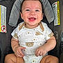 baby, smiling, car_seat, onesie, infant, child, cute, happy, face, hands, legs, seatbelt, pattern, bear, clothing, indoors, person, baby_clothes, sitting, young_child