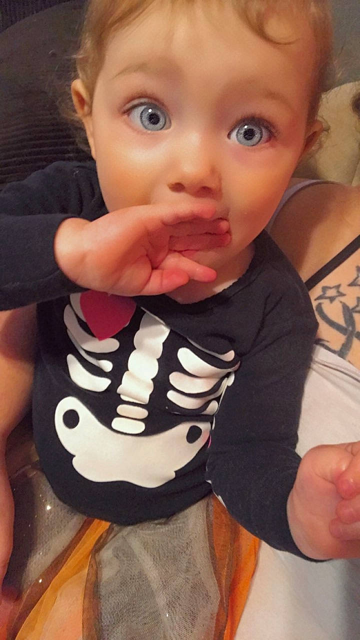 Ryleigh is registered to the contest to win money with this photo: arm, baby_toddler_clothing, cheek, cool, eye, eyelash, face, finger, gesture, happy, head, iris, joint, mouth, neck, nose, person, skin, sleeve, surprise