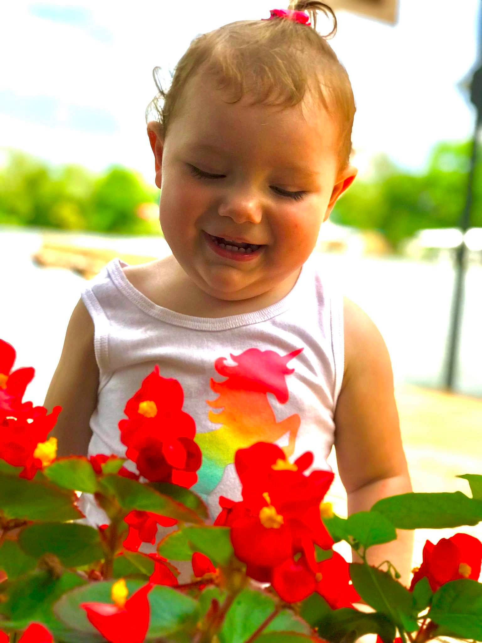 Ryleigh is registered to the contest to win money with this photo: baby_toddler_clothing, dress, eye, face, facial_expression, flower, green, hairstyle, happy, head, joy, light, lip, orange, people_in_nature, person, petal, photograph, plant, skin