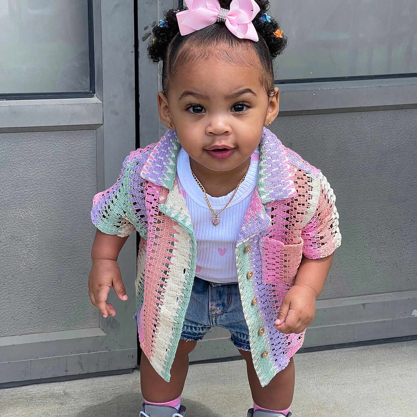 Jersey is registered to the contest to win money with this photo: accessories, blackhair, child, clothing, coat, face, female, footwear, girl, hair, head, jewelry, necklace, pants, person, photography, portrait, shoe, sitting, sleeve