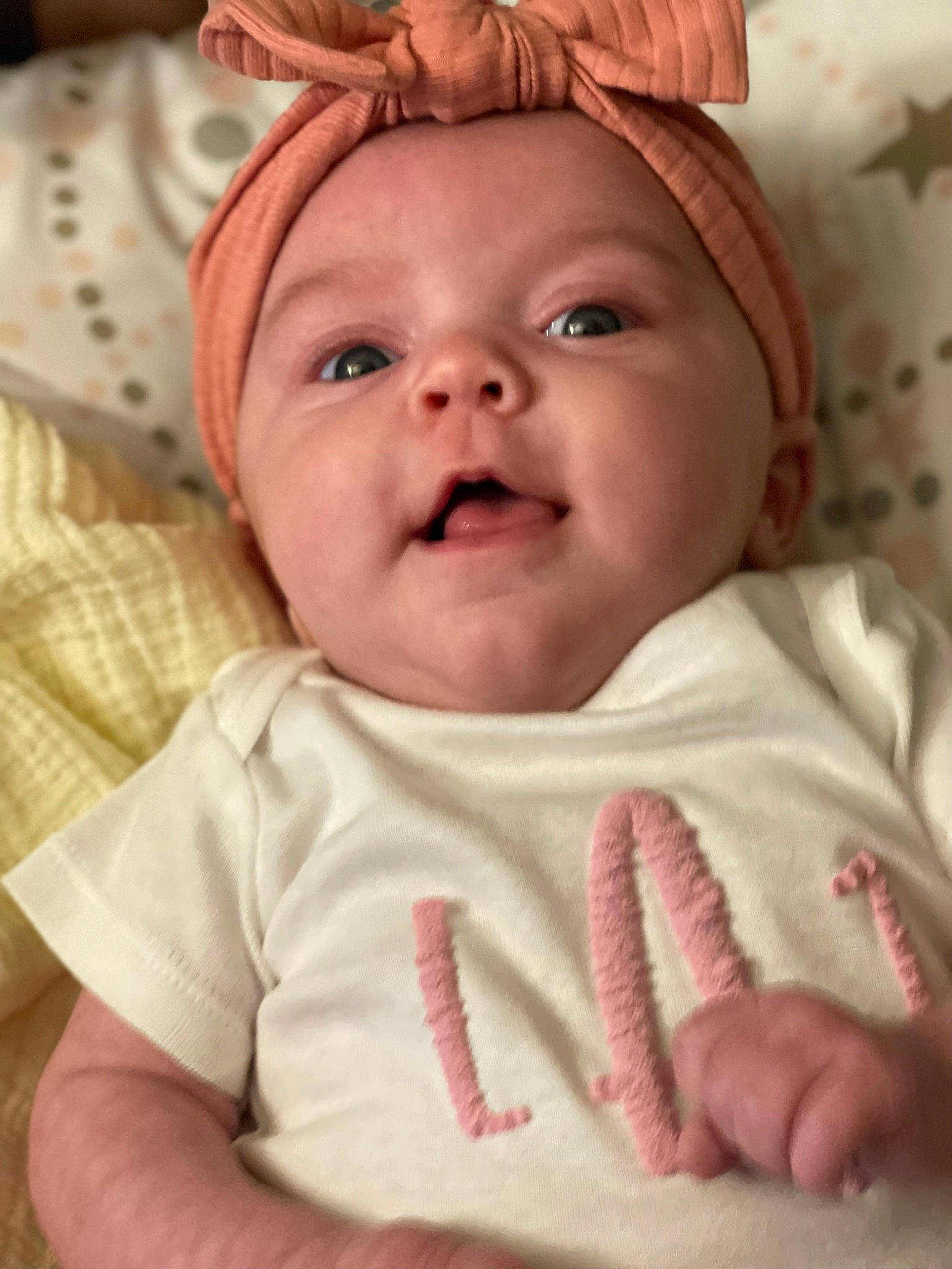 Liana is registered to the contest to win money with this photo: baby, cheek, chin, comfort, eye, eyebrow, face, happy, hat, head, iris, lip, mouth, nose, person, pink, skin, sleeve, smile, textile