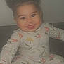 Malahni is registered to the contest to win money with this photo: baby, casual, child, comfortable, couch, cozy, cute, face, floral_pattern, hair_buns, happy, home, indoors, infant, pajamas, portrait, seated, smiling, tongue_out, young_child