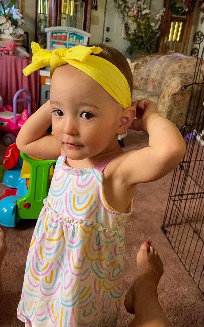 Paisley is registered to the contest to win money with this photo: baby, baby_toddler_clothing, baseball_cap, cap, child, day_dress, dress, event, eye, fun, happy, headwear, leisure, person, pink, public_space, recreation, skin, smile, summer