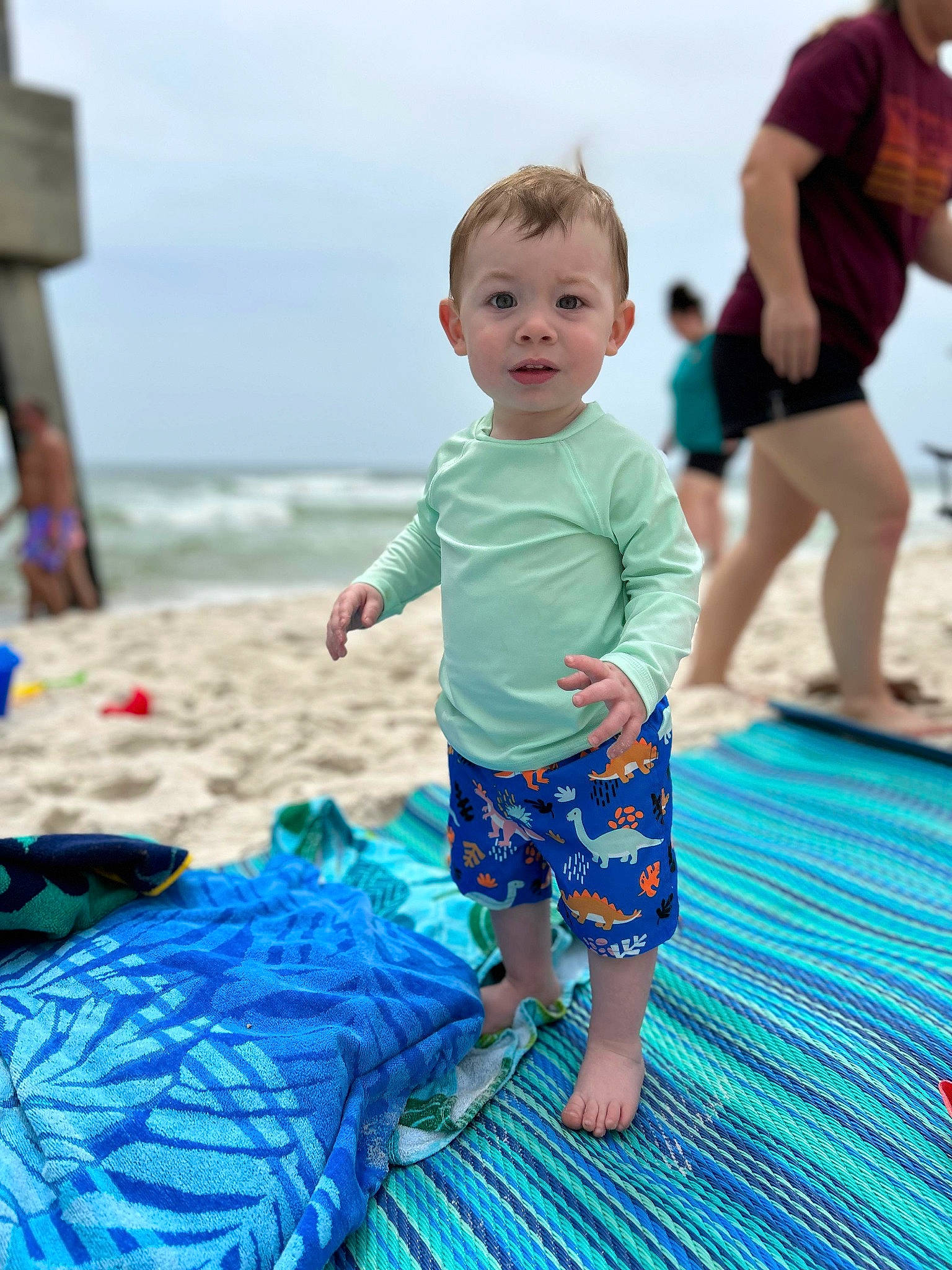 Kase is registered to the contest to win money with this photo: aqua, azure, baby_toddler_clothing, beach, blue, body_of_water, child, electric_blue, fun, happy, human, leisure, people_in_nature, people_on_beach, person, recreation, shorts, sky, summer, toddler