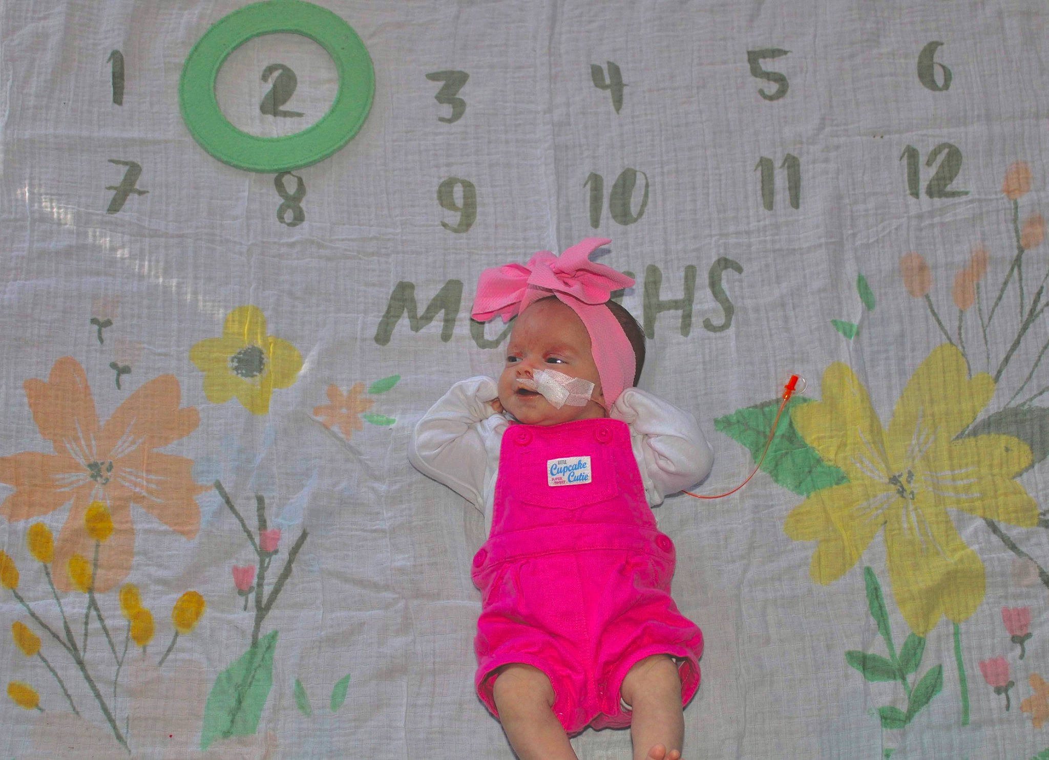 Mikayla is registered to the contest to win money with this photo: baby_toddler_clothing, cap, child, clothing, design, fun, happy, hat, linens, magenta, mammal, pattern, person, pink, plant, product, skin, sleeve, sun_hat, textile