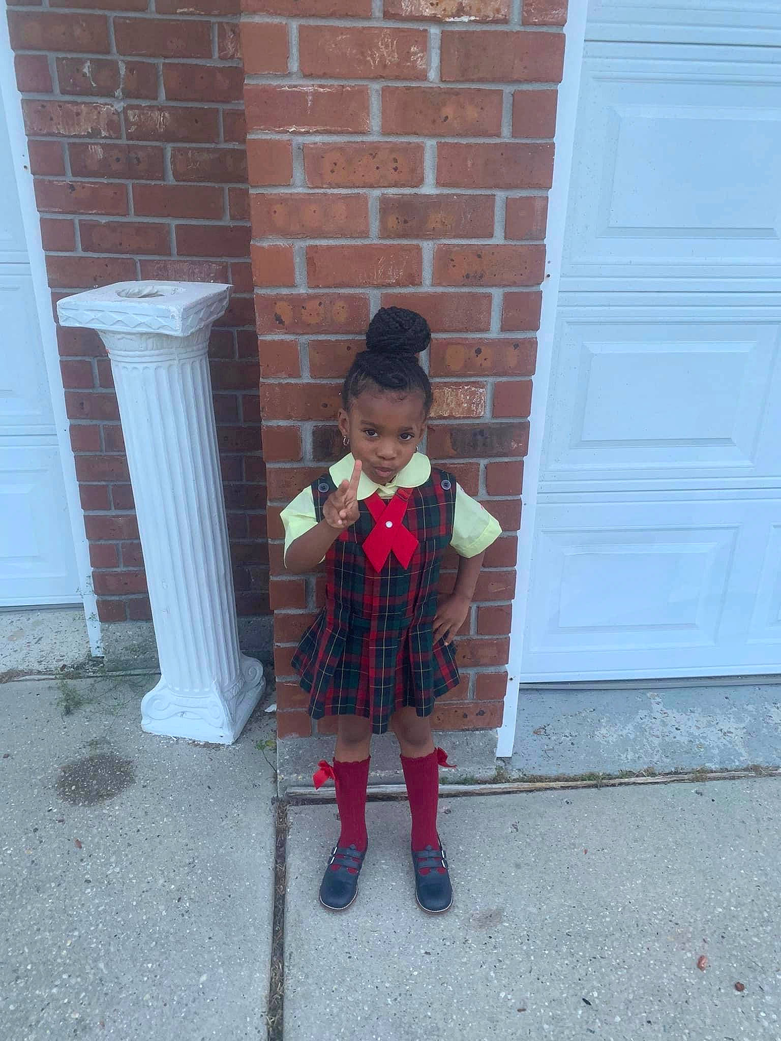 Infinity joined the competition — help win amazing prizes! boot, brick, brickwork, carmine, child, concrete, door, flooring, footwear, hat, leg, pattern, person, plaid, road_surface, sidewalk, standing, toddler, waste_container, waste_containment