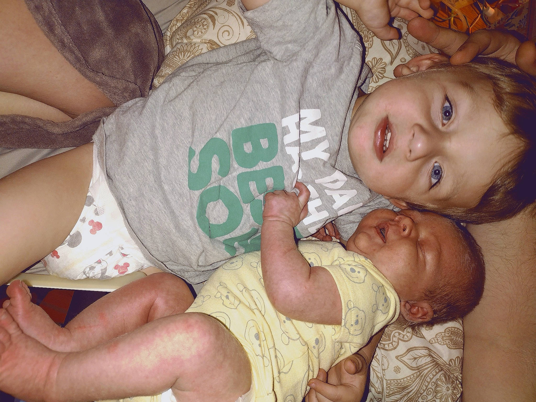 Camden is registered to the contest to win money with this photo: baby, baby_toddler_clothing, cheek, comfort, facial_expression, finger, happy, head, human_body, iris, knee, leg, mouth, muscle, organ, person, skin, textile, thigh, toddler