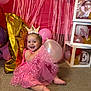Hadlie is registered to the contest to win money with this photo: baby, child, birthday, pink_dress, balloon, crown, number_one, celebration, party, carpet, smiling, tutu, decorations, streamers, gold_balloon, pink_balloon, happy, indoors, festive, cute