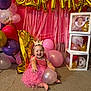 baby, child, birthday, party, pink_dress, crown, balloon, gold_balloon, number_one, blocks, carpet, smiling, celebration, indoors, decorations, happy, cute, one_year_old, festive, playful