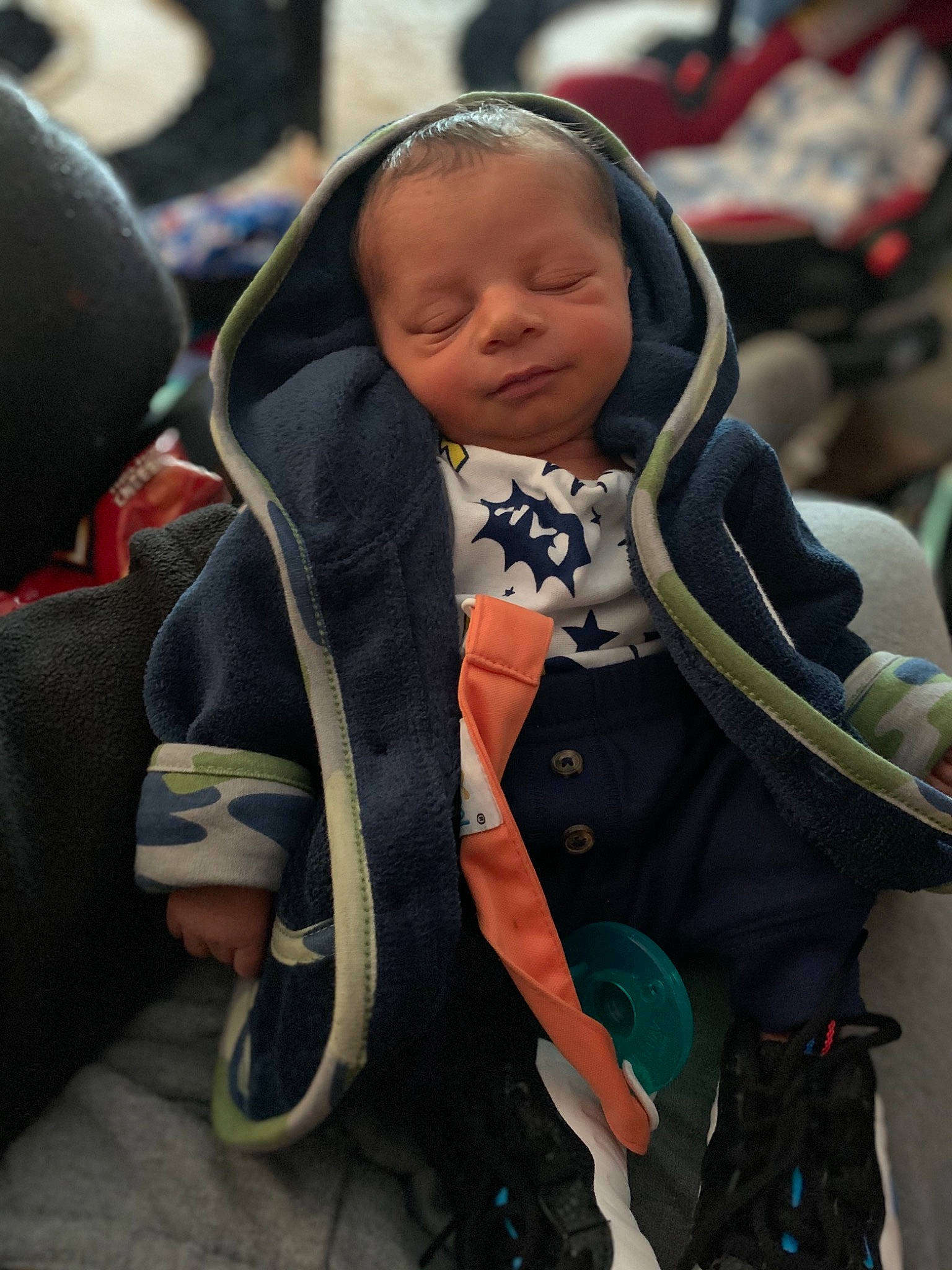 Marcel is registered to the contest to win money with this photo: baby, baby_carriage, baby_products, baby_toddler_clothing, child, comfort, event, face, happy, person, personal_protective_equipment, polar_fleece, public_event, toddler