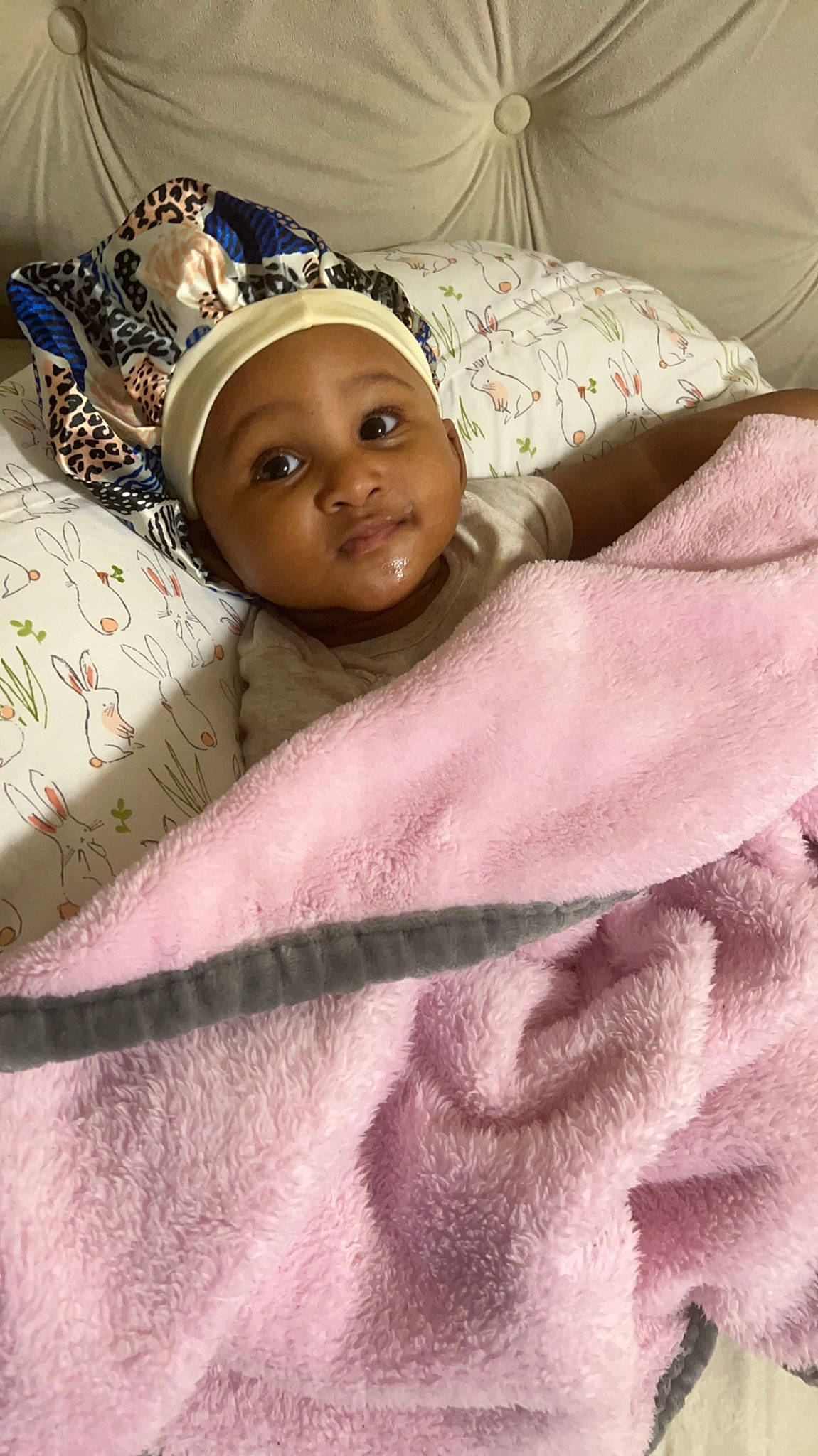 Brooklynne is registered to the contest to win money with this photo: baby_sleeping, bed, bed_sheet, bedding, bedtime, child, comfort, event, eyebrow, fur, happy, headgear, headpiece, headwear, linens, magenta, nap, person, pink, room