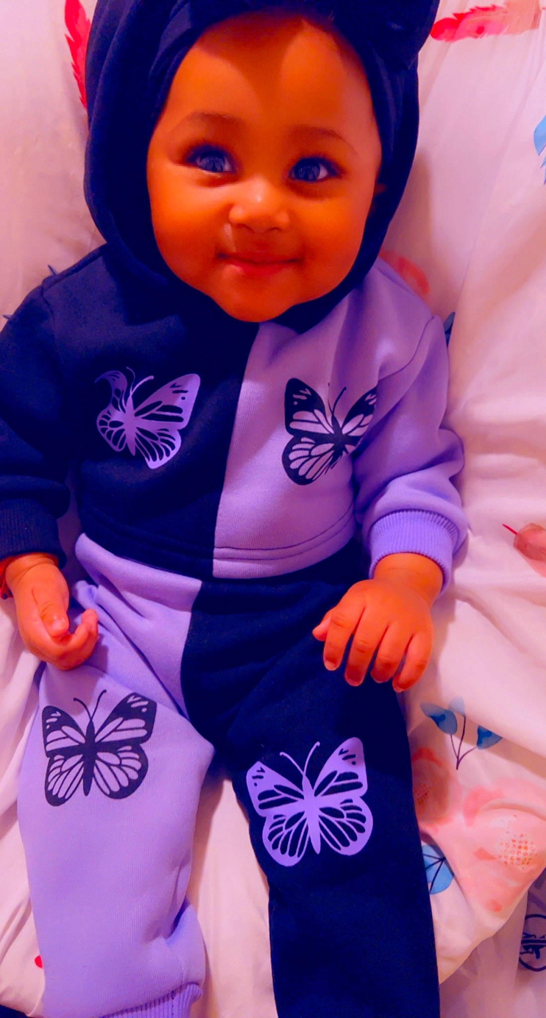 Brooklynne is registered to the contest to win money with this photo: arm, baby_toddler_clothing, blue, cool, eye, face, finger, hand, happy, joy, neck, organ, outerwear, person, pink, product, purple, skin, sleeve, smile
