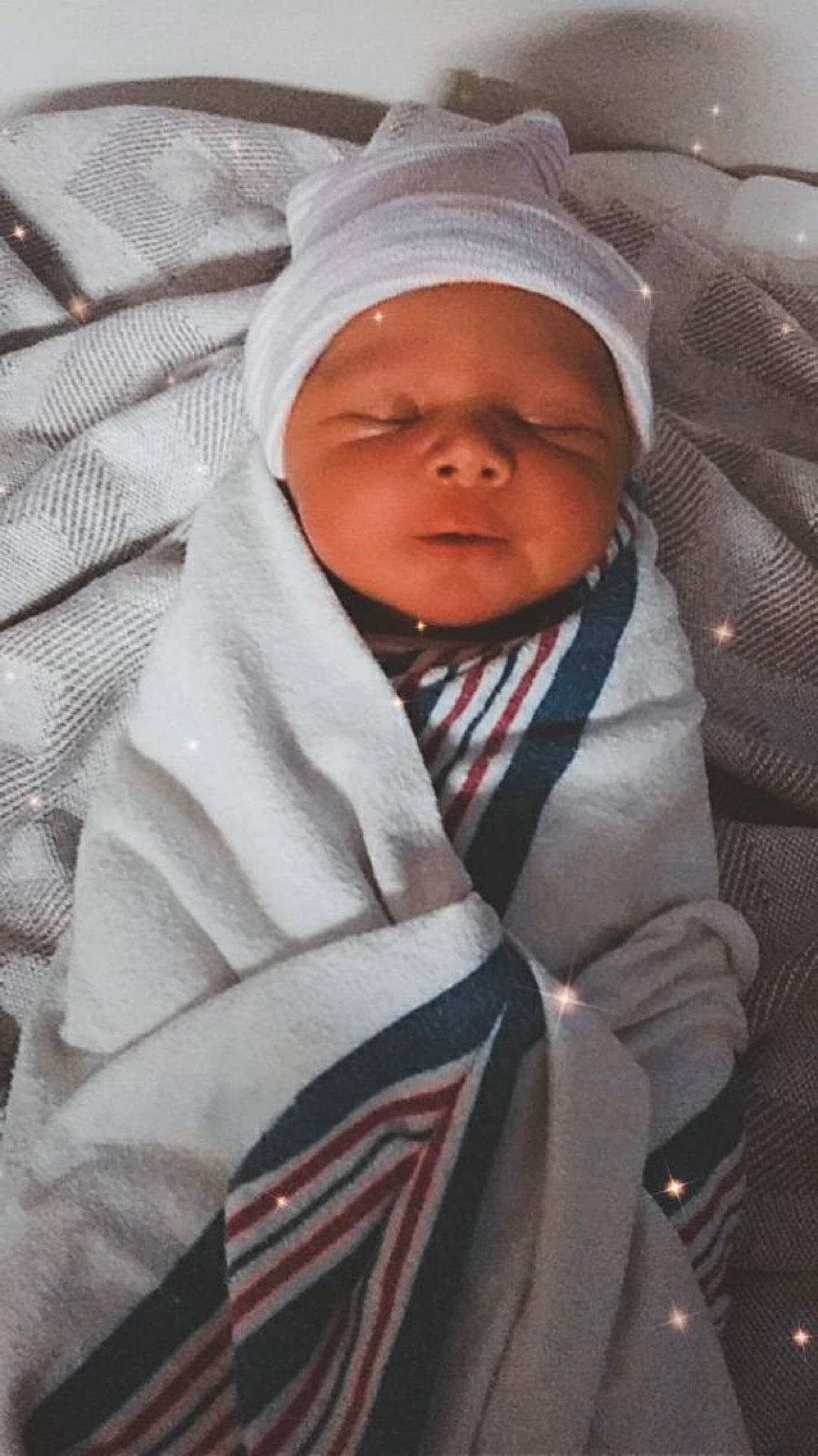 Kash joined the competition — help win amazing prizes! baby, baby_products, baby_safety, baby_toddler_clothing, carmine, cheek, child, comfort, eye, headwear, linens, person, sitting, sleeve, toddler