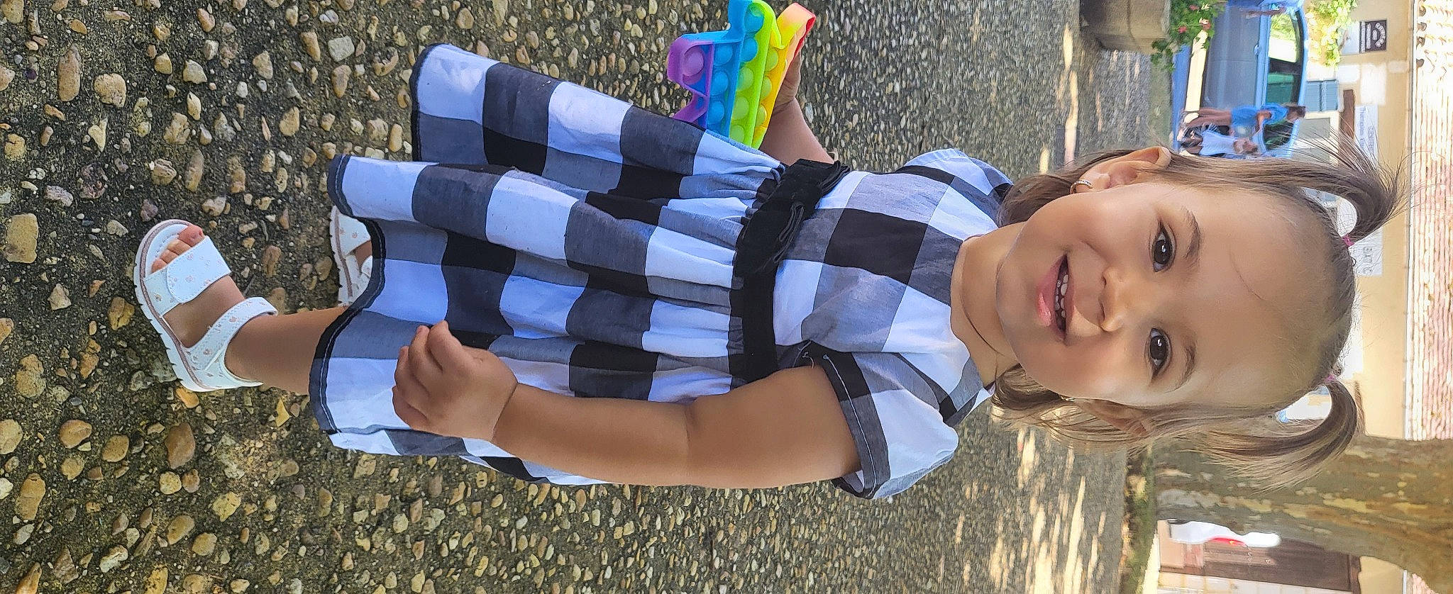 Natalia participe au concours pour gagner de l'argent avec cette photo : beauty, child, fun, grass, hand, happy, human_leg, joint, joy, knee, leisure, pattern, people_in_nature, person, plaid, plant, recreation, sitting, smile, summer