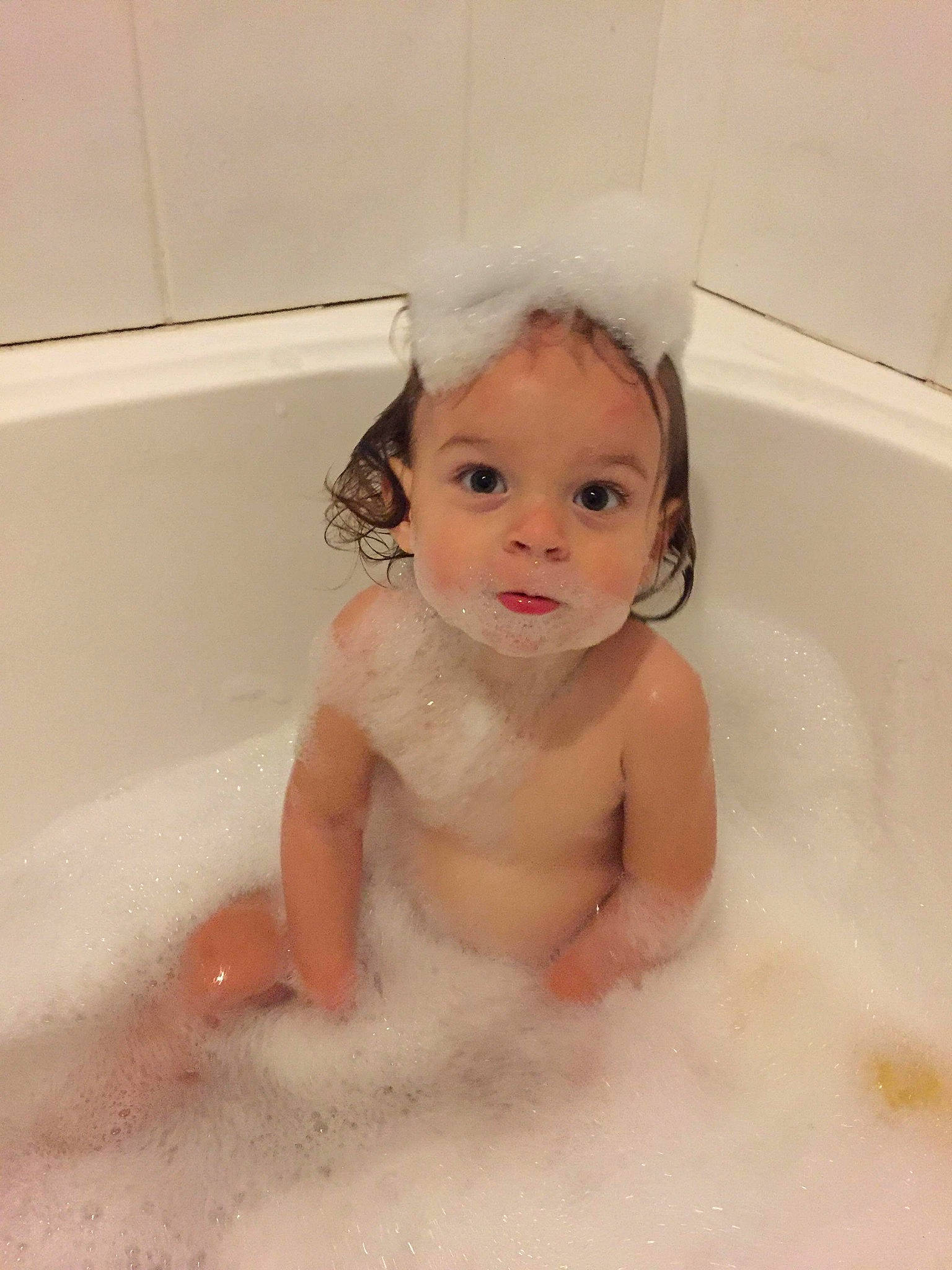 Ruby is registered to the contest to win money with this photo: baby, baby_bathing, bathing, bathtub, child, face, foam, fun, head, person, plumbing_fixture, skin, toddler, washing
