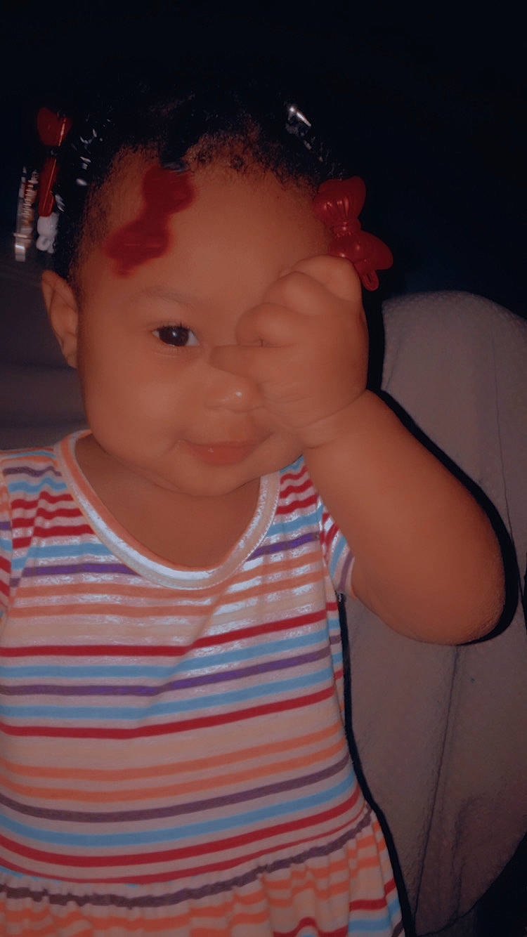 Ranijah is registered to the contest to win money with this photo: arm, baby, baby_toddler_clothing, cheek, chin, ear, eye, eyebrow, eyelash, forehead, human_body, iris, lip, mouth, neck, nose, person, shoulder, skin, sleeve