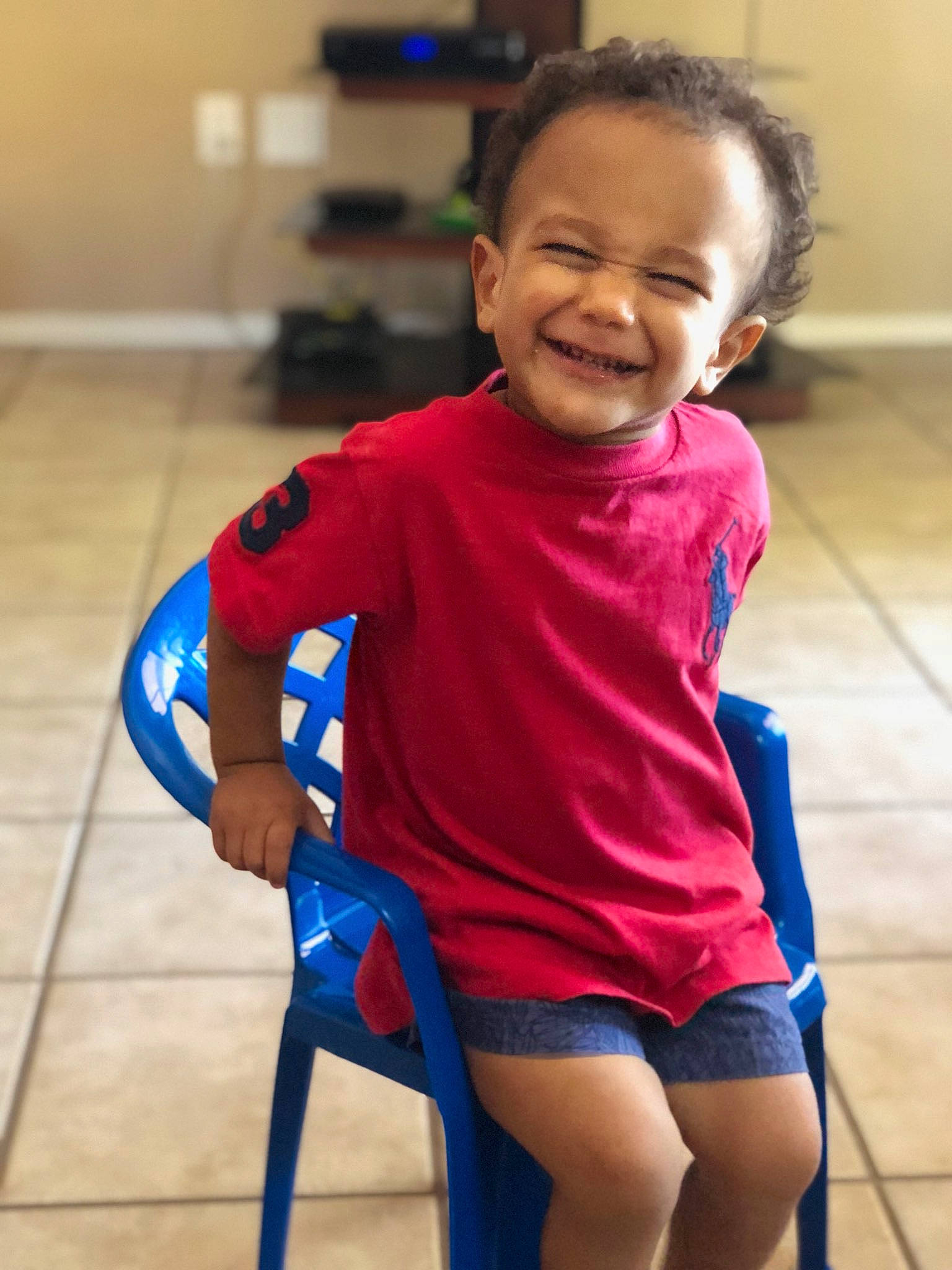 Kaizen is registered to the contest to win money with this photo: arm, blue, child, day, facial_expression, fun, girl, joint, joy, person, play, product, shoulder, smile, sportswear, standing, t_shirt, toddler