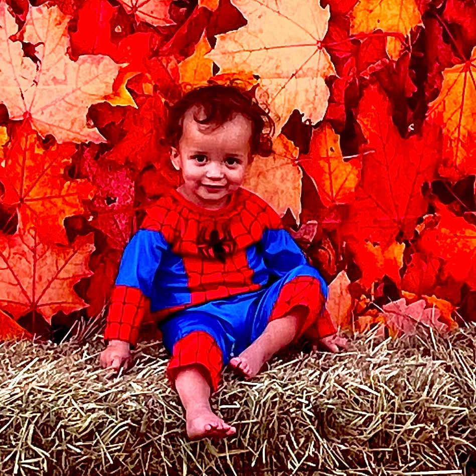 Bellamy joined the competition — help win amazing prizes! baby, clothing, face, happy, head, jeans, leaf, maple, mapleleaf, nature, outdoors, pants, person, photography, plant, portrait, sitting, smile, tree, vegetation