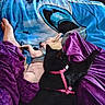 Raven is registered to the contest to win money with this photo: animal, bare_foot, black_cat, blanket, blue_blanket, companion, cozy, domestic_animal, flooring, fur, home, indoor, pet_harness, pets, purple_blanket, relaxation, resting, snuggling, white_dog, wood_floor