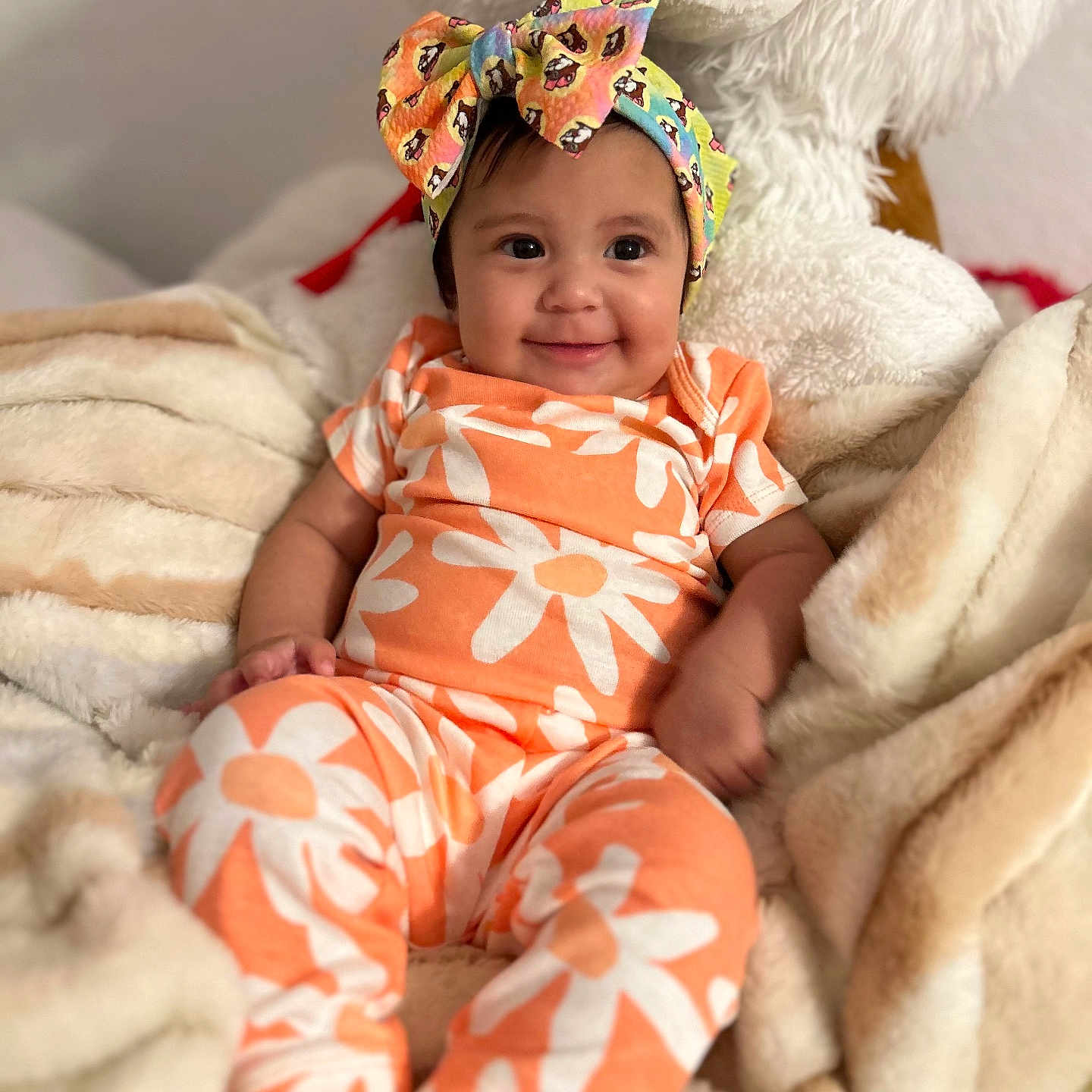 Novalee joined the competition — help win amazing prizes! baby, babylaughing, beachwear, blanket, bonnet, cap, clothing, face, happy, hat, head, newborn, pajamas, person, photography, portrait, quilt, sitting, smile