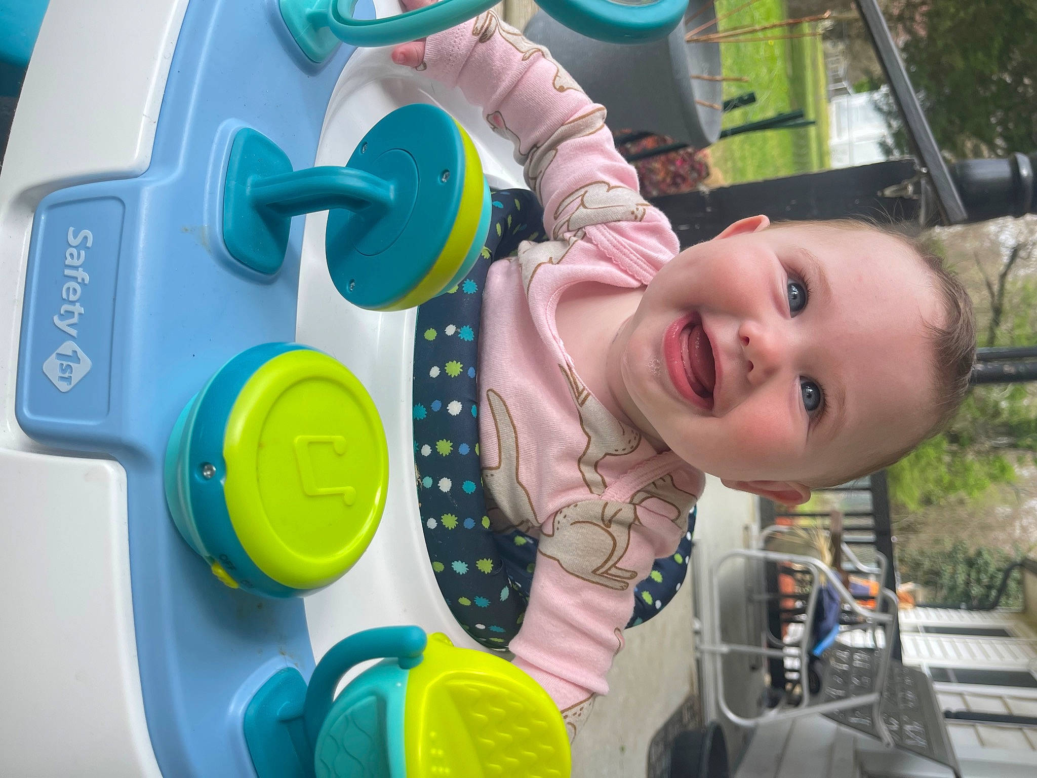 Ainsley is registered to the contest to win money with this photo: baby, baby_products, baby_toddler_clothing, child, fun, green, happy, hearing, joy, leisure, mouth, nose, organ, person, recreation, skin, smile, snapshot, toddler, toy
