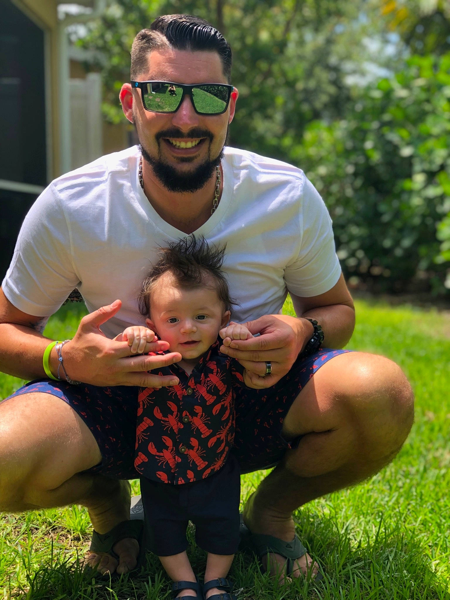 Kace is registered to the contest to win money with this photo: child, father, fun, glasses, grass, green, happy, headwear, joy, lawn, male, people, person, photography, plant, toddler, vacation