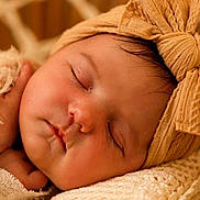 Alba participe au concours pour gagner de l'argent avec cette photo : baby, newborn, sleeping, headband, bow, blanket, closeup, cute, face, infant, soft, peaceful, wrapped, resting, skin, adorable, child, portrait, warm, cozy