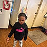 Kylie is registered to the contest to win money with this photo: child, crying, birthday, headband, hoodie, puma, indoor, floor, wood_floor, fridge, decorations, homedecor, person, barefoot, leggings, window, door, rug, broom, emotional