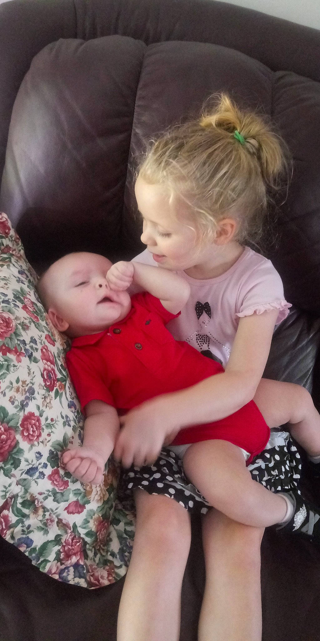 Addalynn joined the competition — help win amazing prizes! baby, cheek, child, daughter, finger, gesture, interaction, lap, leg, mother, person, sibling, sitting, skin, smile, thumb, toddler